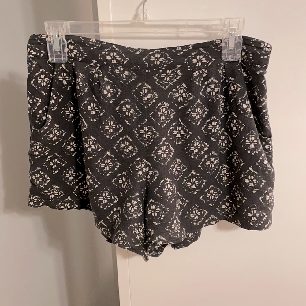Black print rayon shorts. Elastic waist in back